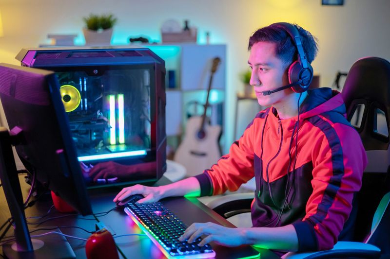 a male esports player gaming on a computer
