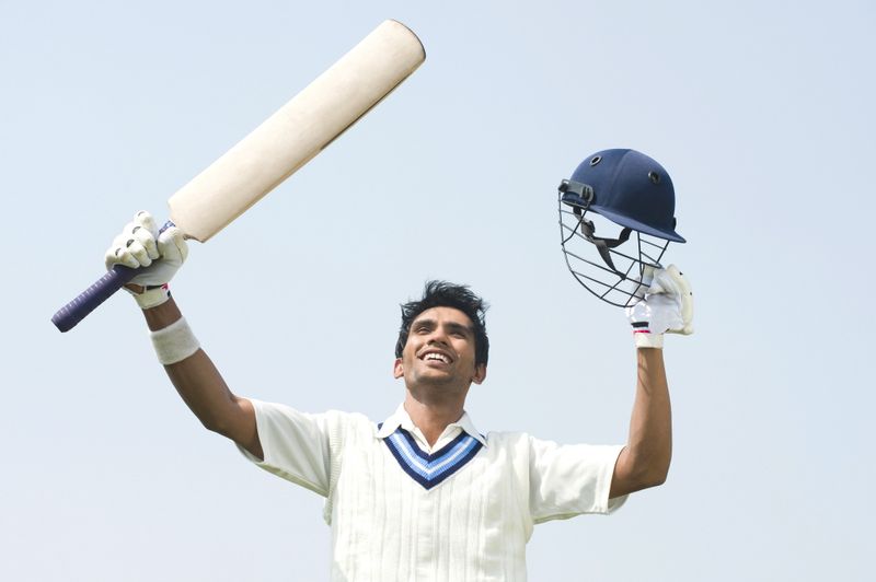 A male cricket player celebrating