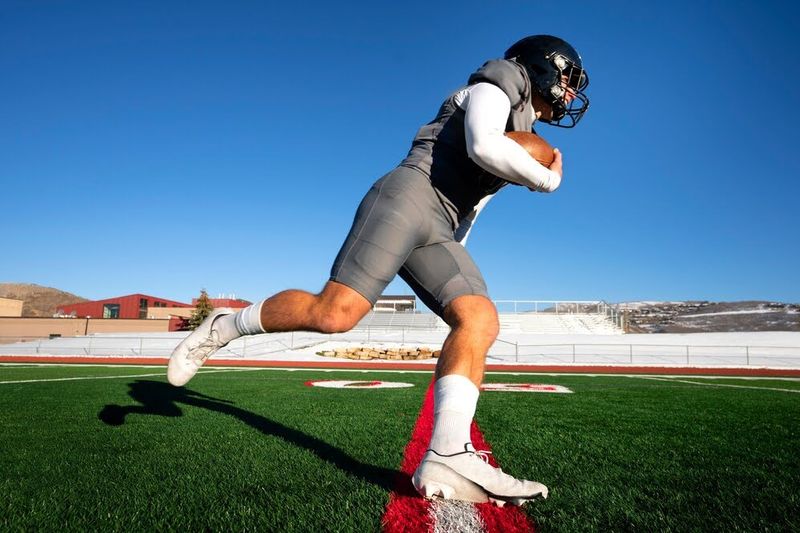 Football player running in cleats