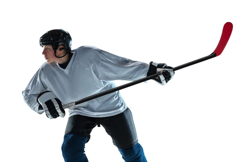 a youth hockey player holding a hockey stick