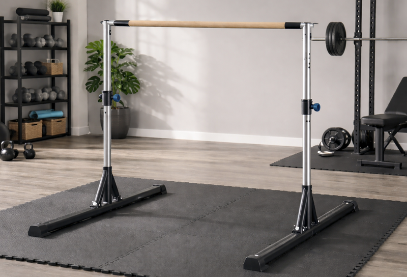 an adjustable kip bar in the middle of a home gym