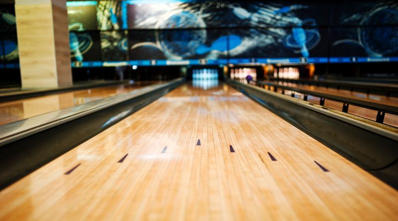 a close up of bowling lane arrows