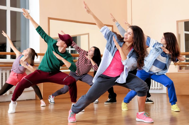 a dance team dancing in a dance studio