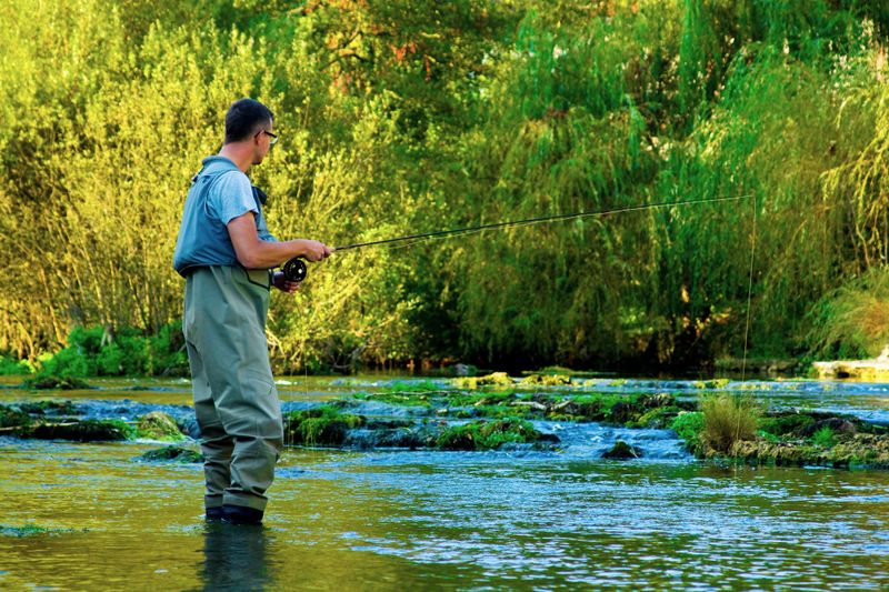 a man fishing in a river