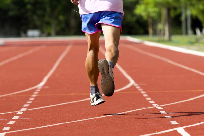 a track and field athlete running on a track