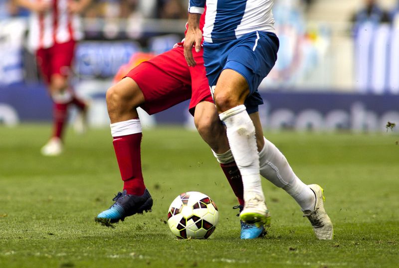 two soccer players on soccer pitch