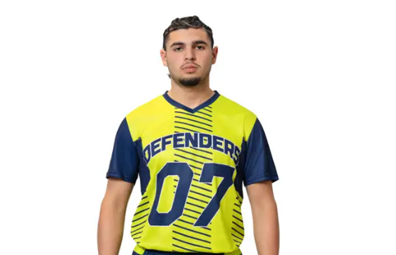 a male adult wearing a custom soccer jersey