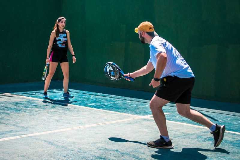 a padel team playing padel outdoors