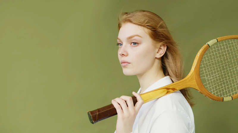 a female tennis player holding a tennis racket