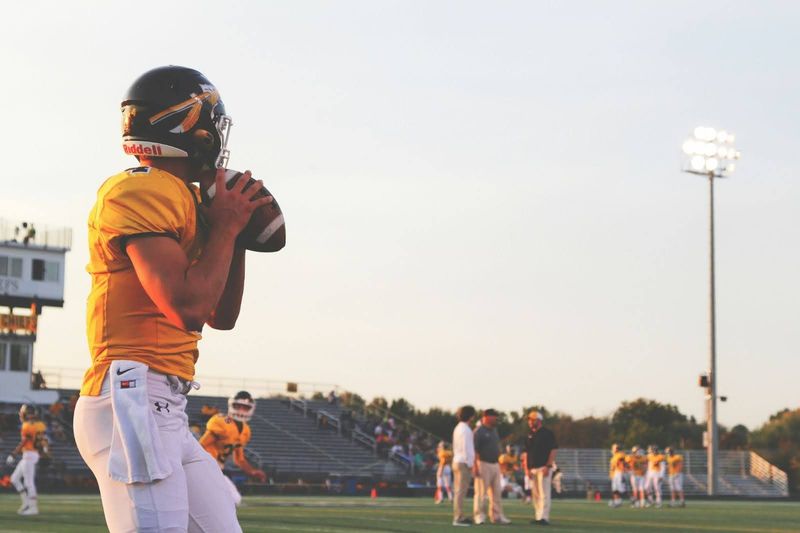 Quarterback about to throw