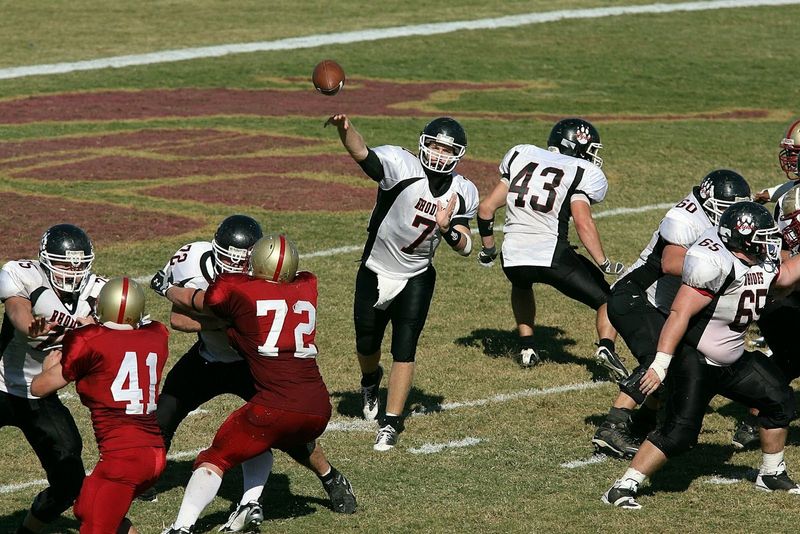 a high school quarterback throwing a football