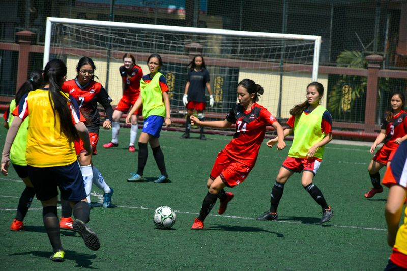 a youth girls soccer team playing a soccer match