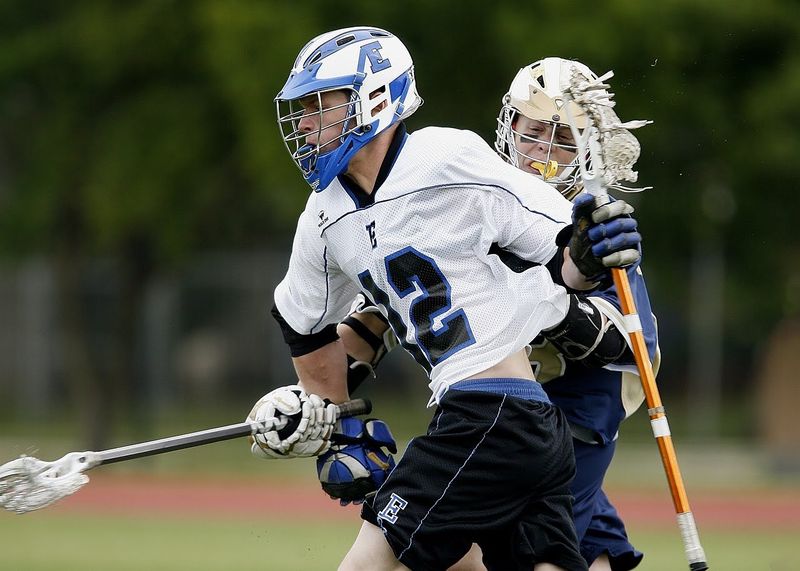 two lacrosse players during a match