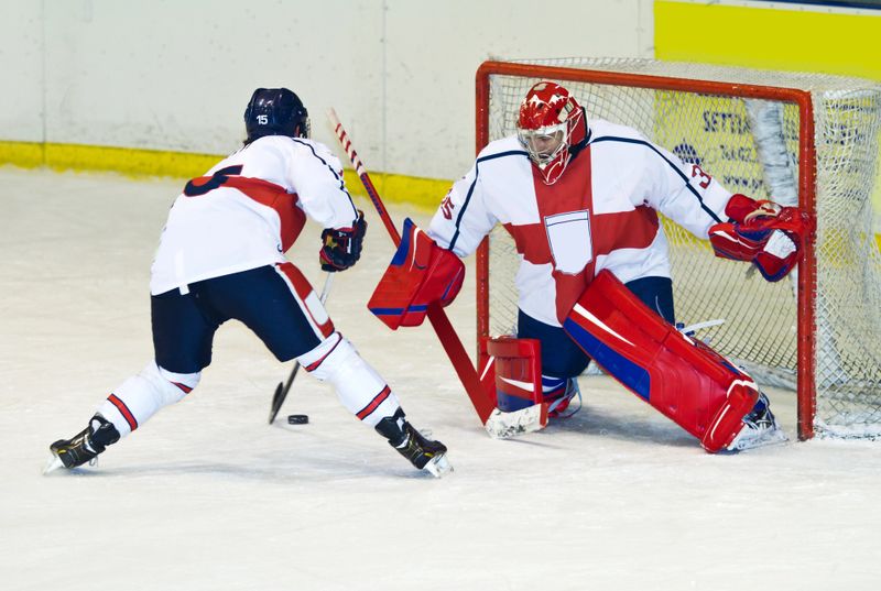 a hockey player about to take a shot at a goal