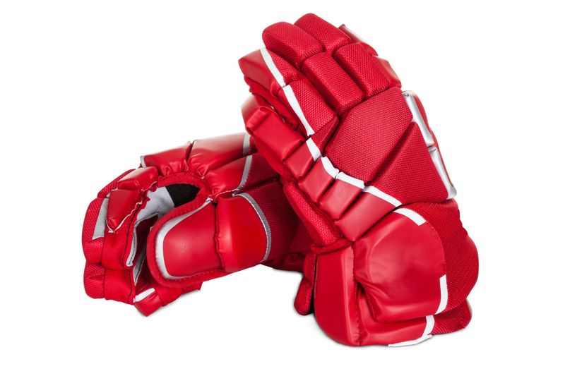 a pair of red ice hockey gloves against a white background