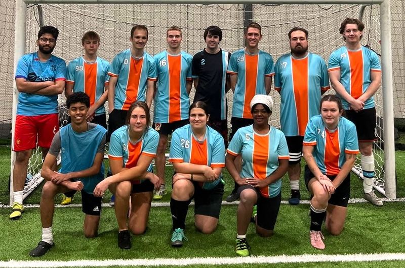 a soccer team wearing matching jerseys