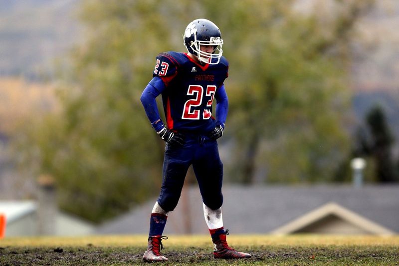 a football player dressed for cold weather football practice