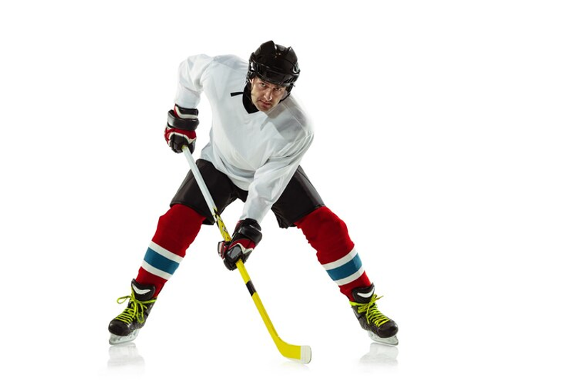 a male ice hockey player holding a hockey stick