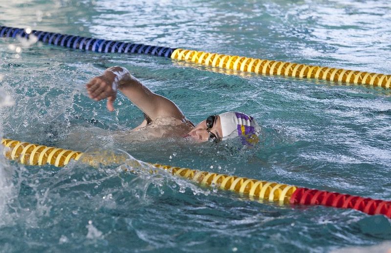 a swimmer swimming in a pool lane