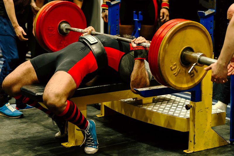 a powerlifter attempting a bench press lift