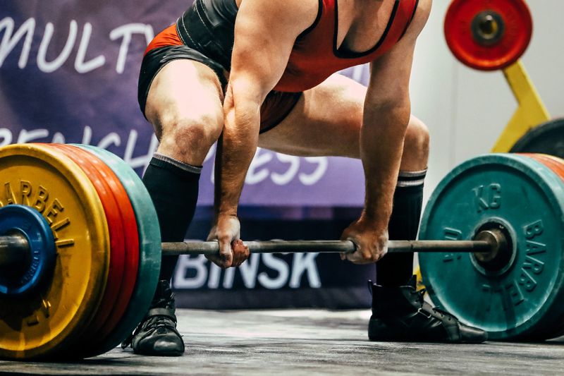 a powerlifting about to lift a barbell