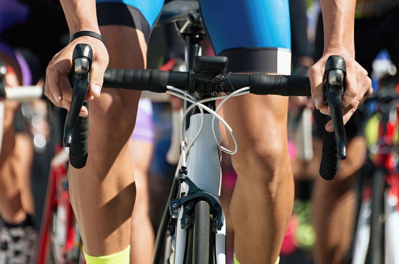 a close up shot of a cyclist on a bicycle