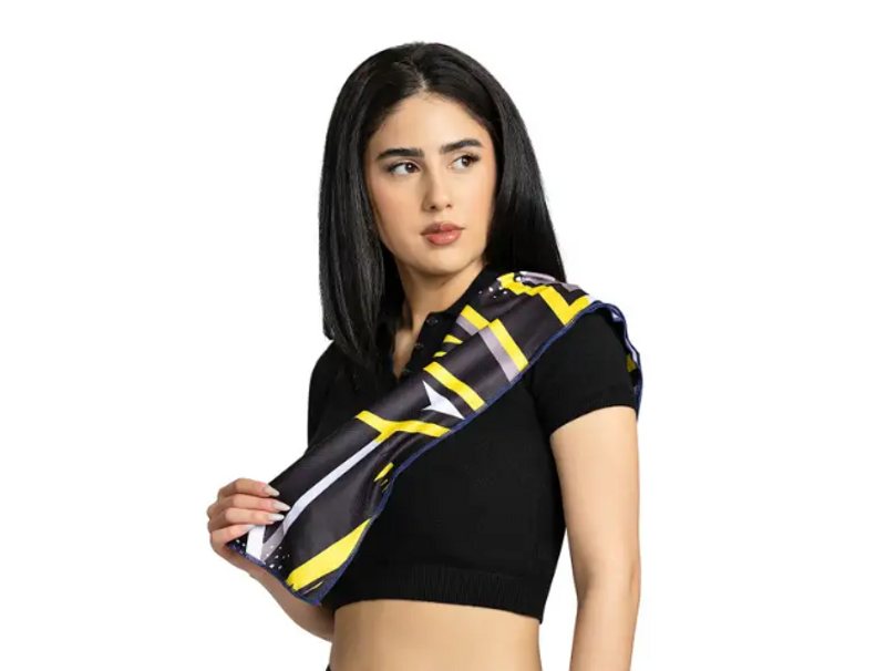 an adult female with a black and yellow cooling towel draped over her shoulder