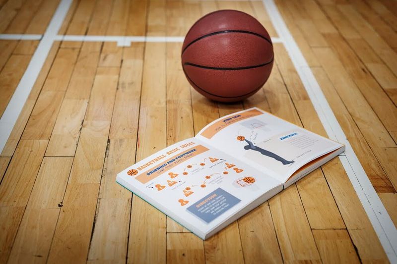 a basketball and book on a basketball court