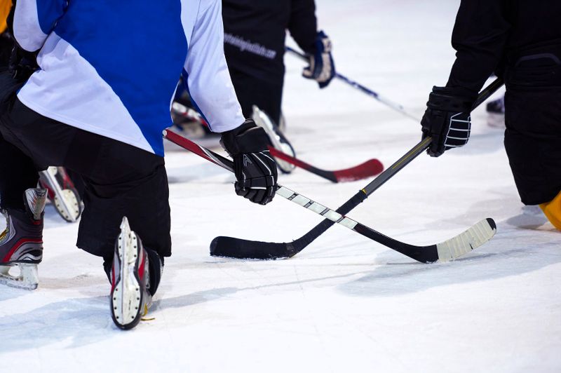a drop puck moment in an ice hockey game