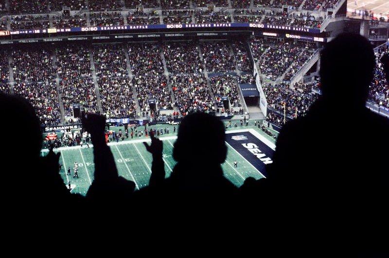 an american football game in a stadium with fans celebrating
