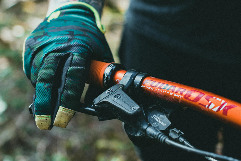 a close up of a mountain bike riders right glove