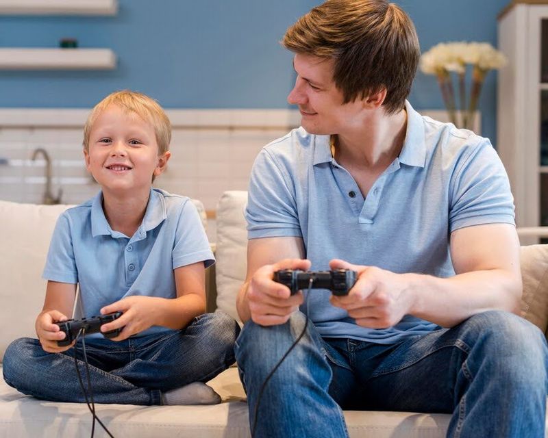 kid and dad playing video games