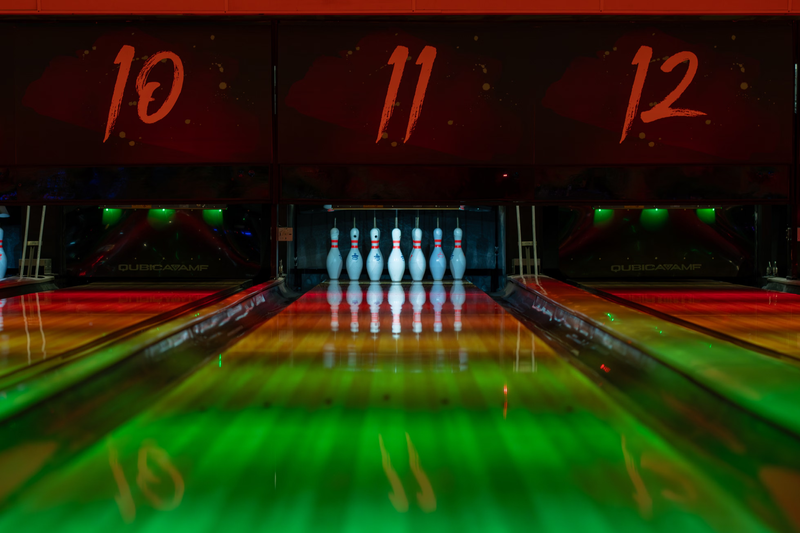 a bowling alley lane with pins standing up
