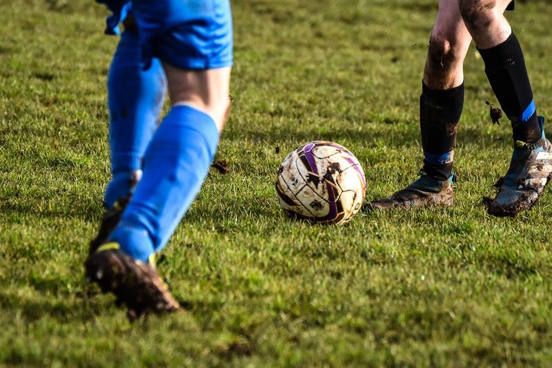 soccer cleats covered in mud