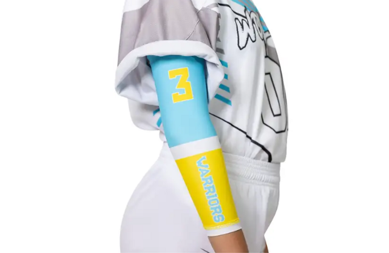 a female athlete wearing a blue and yellow arm sleeve
