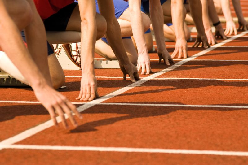 track and field athletes at the start line