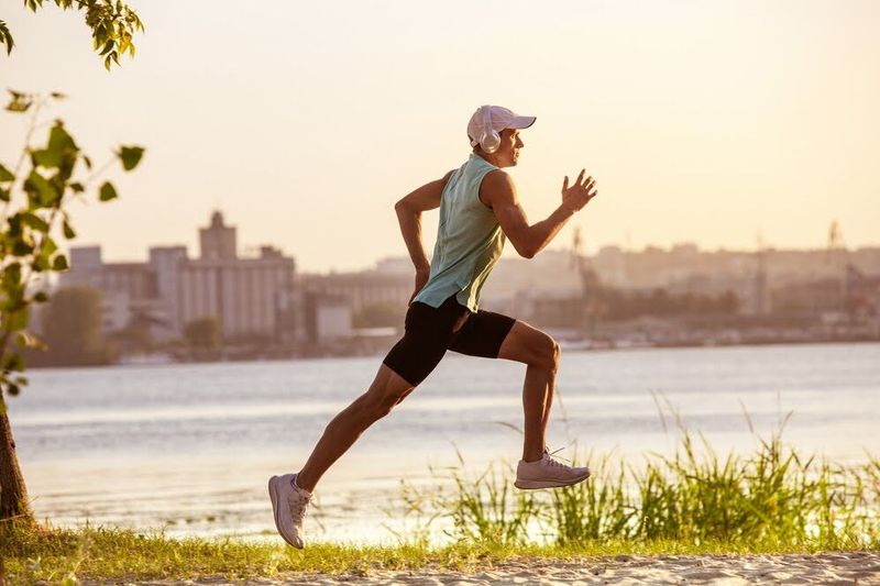 track athlete running along a river