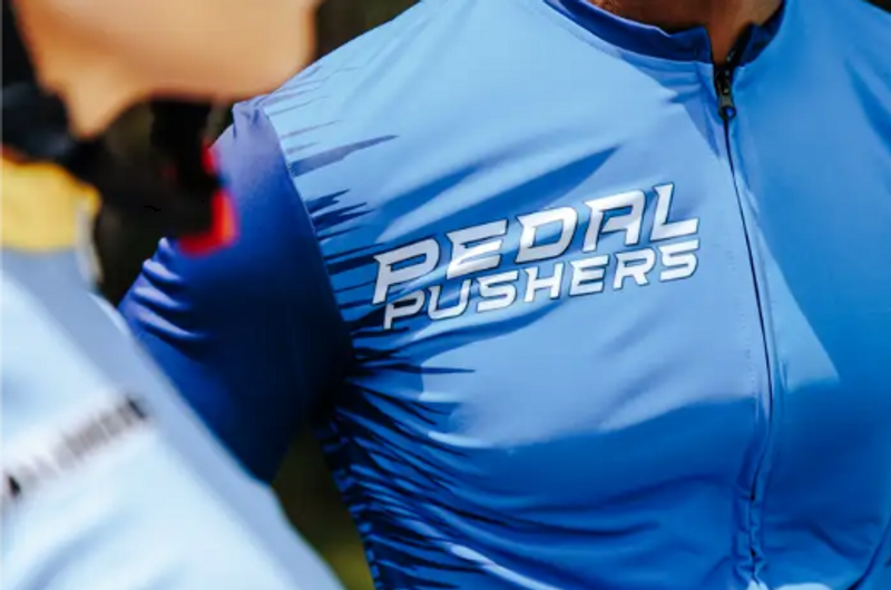 a close up of a custom cycling jersey on an adult male cyclist