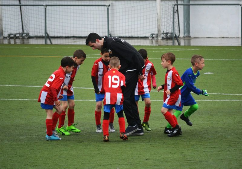 a youth soccer team training indoors