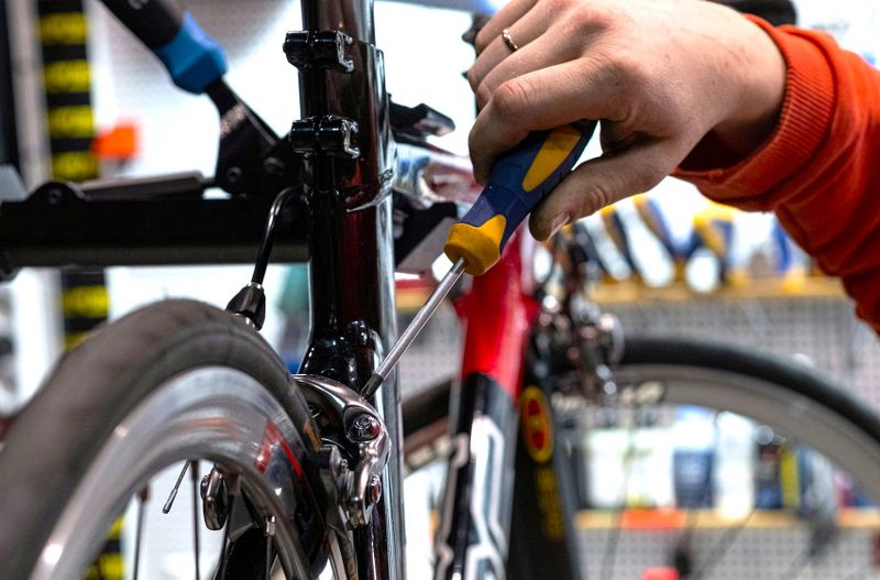 a person repairing their bicycle