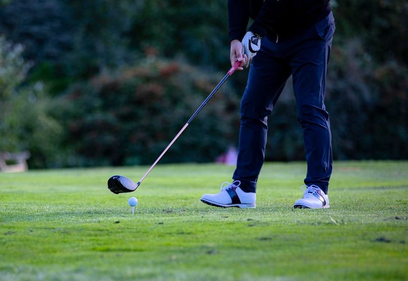a man about to take a golf swing
