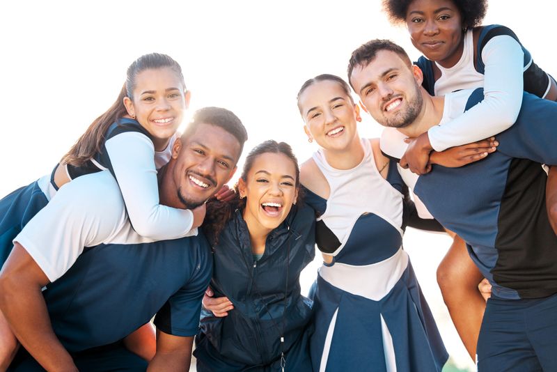 a group of cheerleaders posing for a group photo