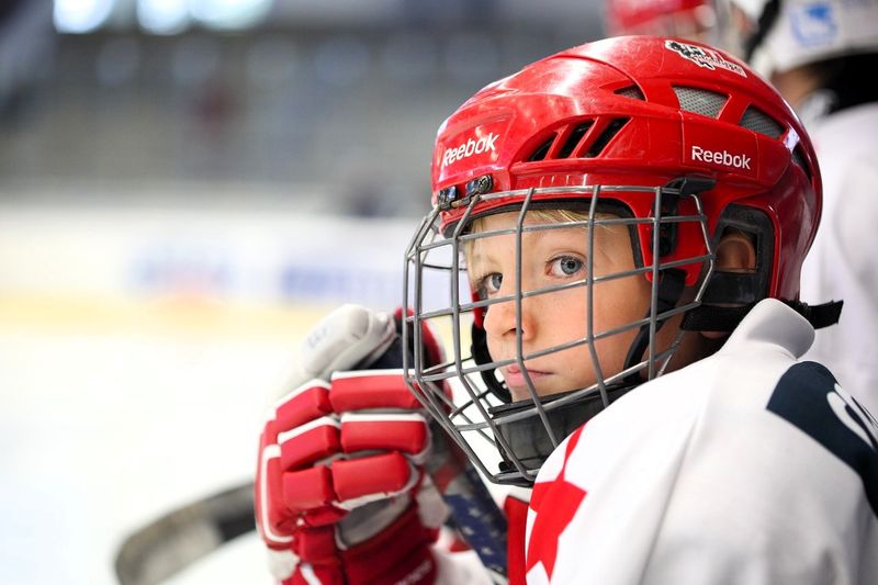 a youth hockey player wearing gloves