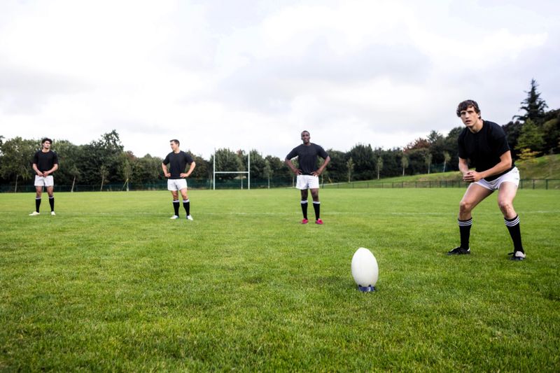 rugby players training on a rugby pitch