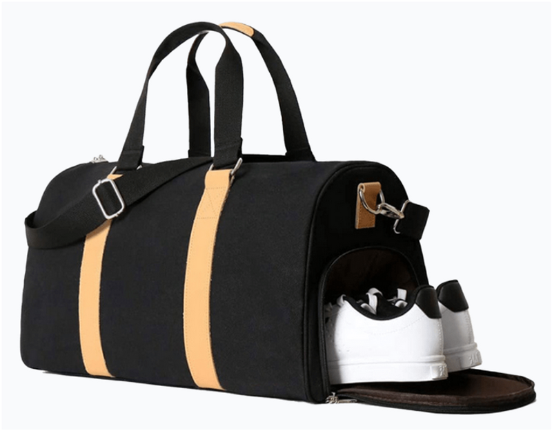 a black duffle bag with an end pocket for shoes
