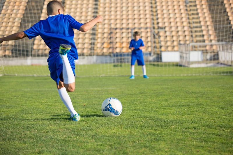 a child kicking a football