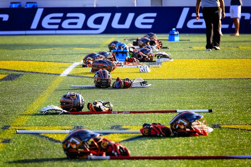 lacrosse gear on a lacrosse pitch