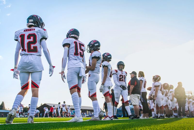 a youth football team on the sidelines