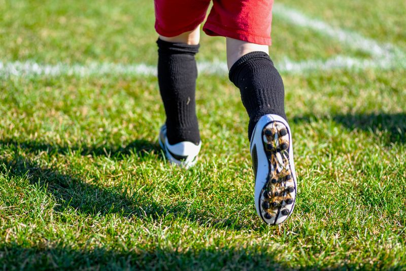 a close up of the bottom of a soccer cleat used for grass